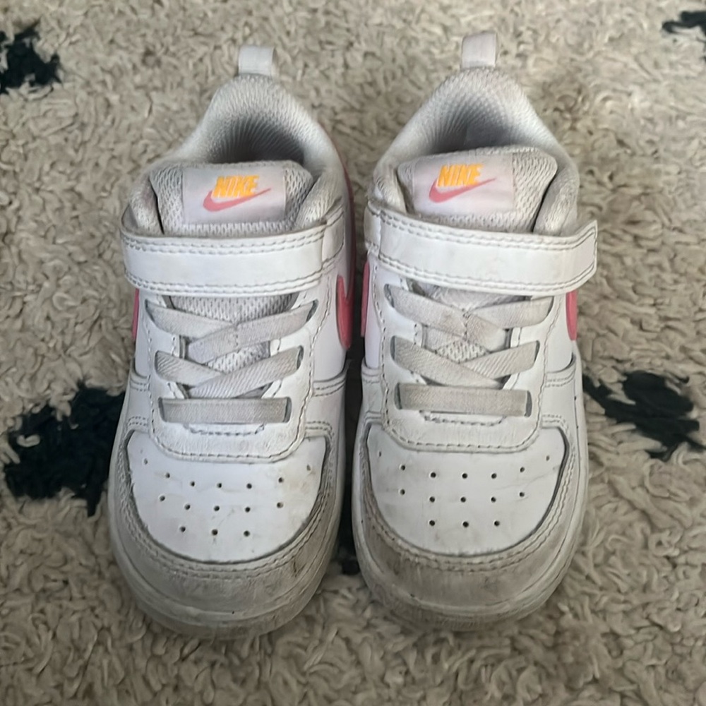 Gently worn white and pink Nike sneakers